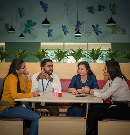 A person is lab coat working with a machine